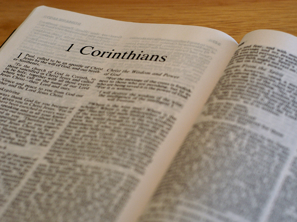 This is a photo of a Bible opened to 1 Corinthians